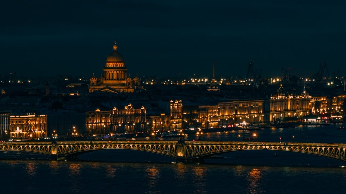 Saint Petersburg at night: church, river and bridge in orange city light